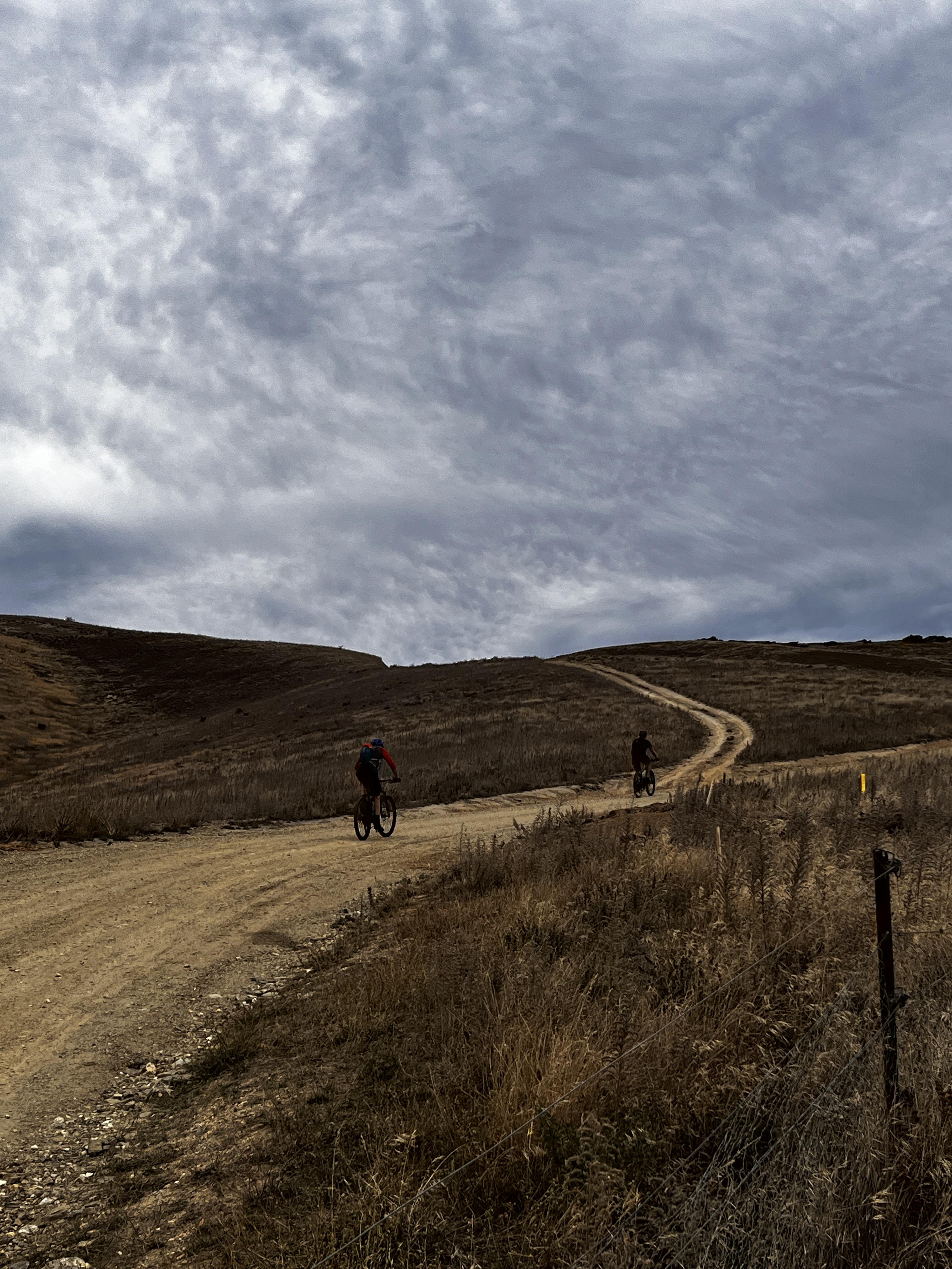 Winding road with bikers biking up it Symbolizes a business growing