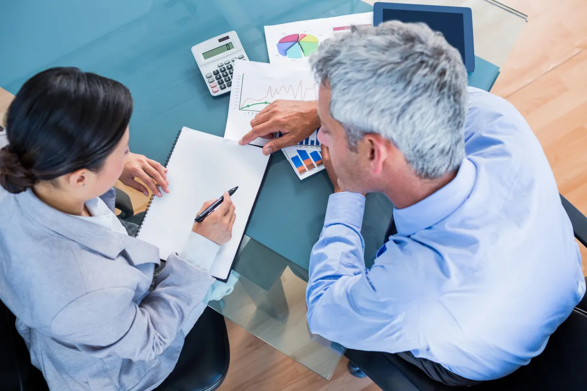 stacked round gold-colored coins on white surface