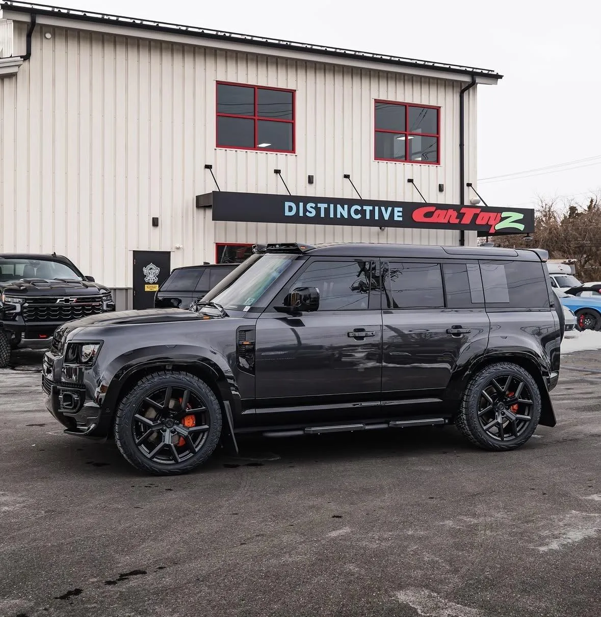 customized urban defender positioned outside of car toyz in egg harbor township new jersey