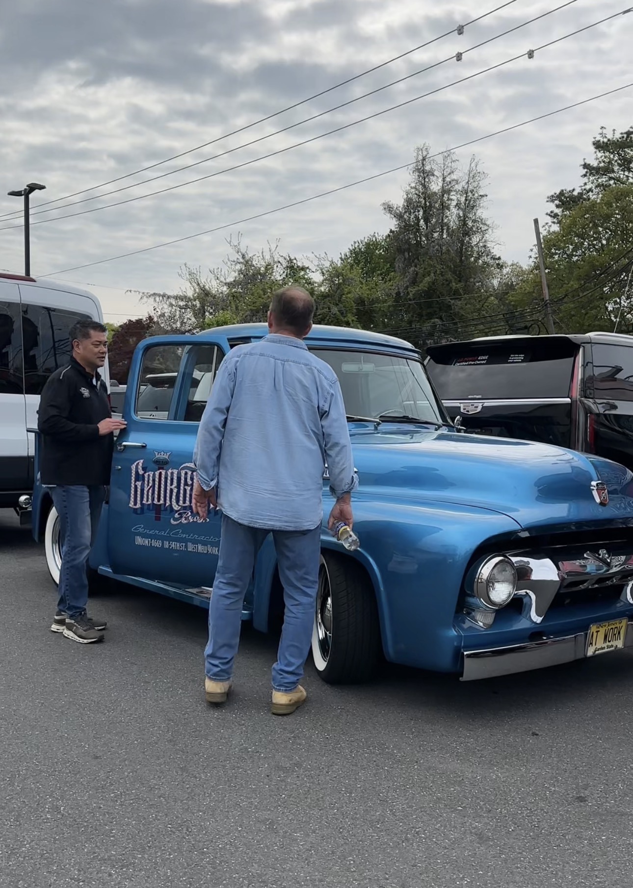 Car Toyz Owner James Lin with Scott Georgetti in front of a 1950s Ford