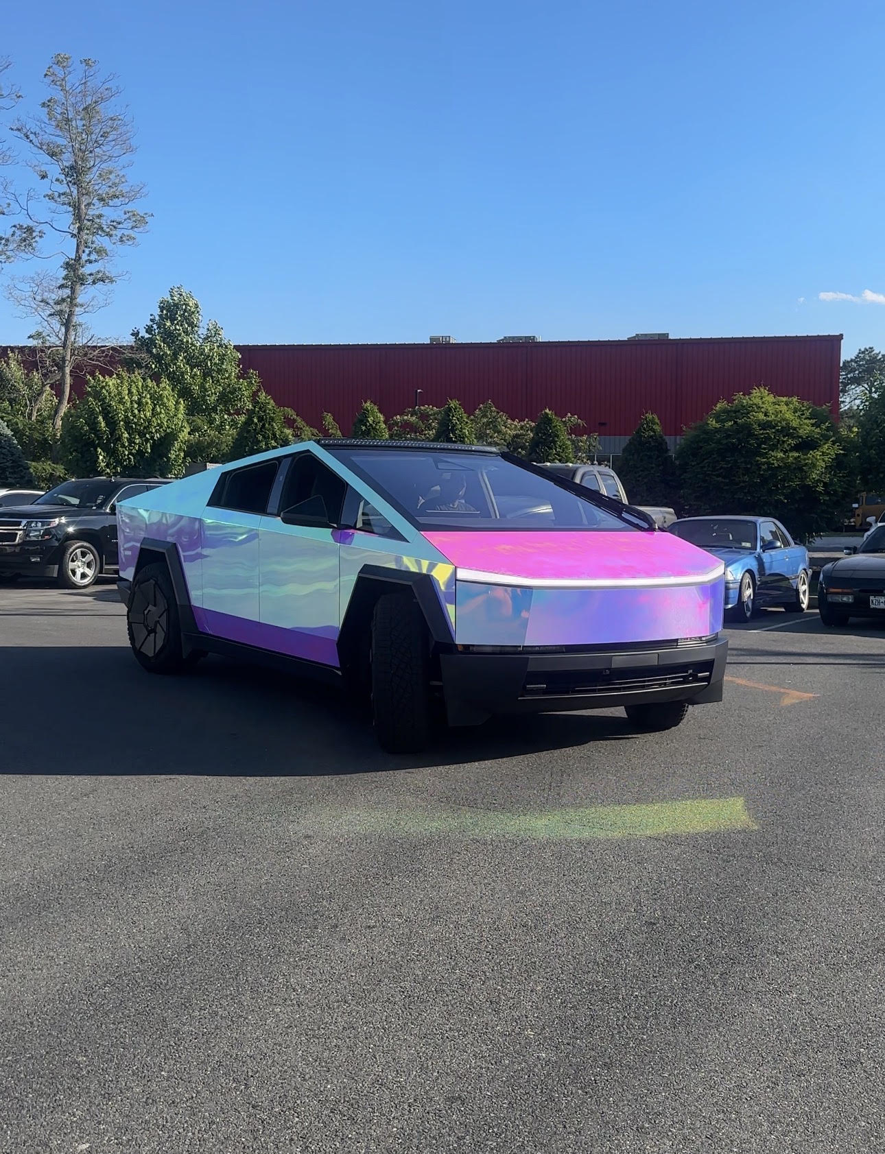 Tesla Cyber Truck wrapped in rainbow chrome at Distinctive Car Toyz in Egg Harbor Township, NJ