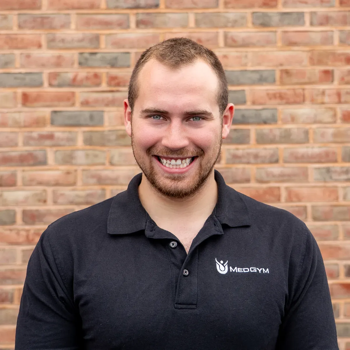 Headshot of Calvin Nause smiling in the gym