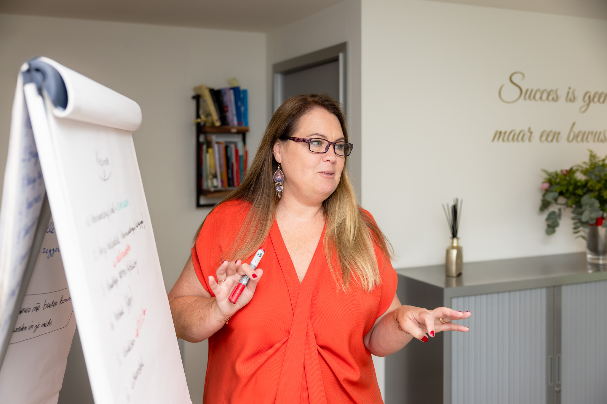 a group of people standing in an office