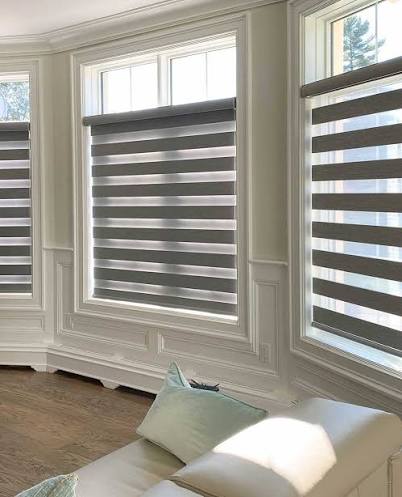 Modern zebra shades with alternating sheer and solid fabric panels