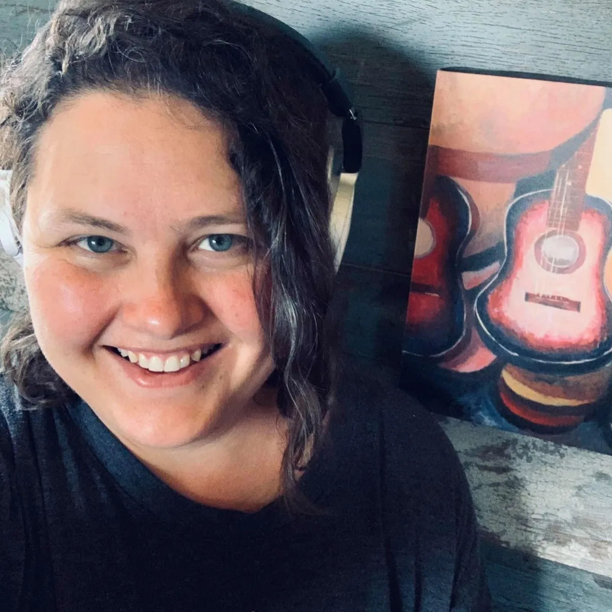 Editorial portrait of the songwriter in an intimate, softly lit studio