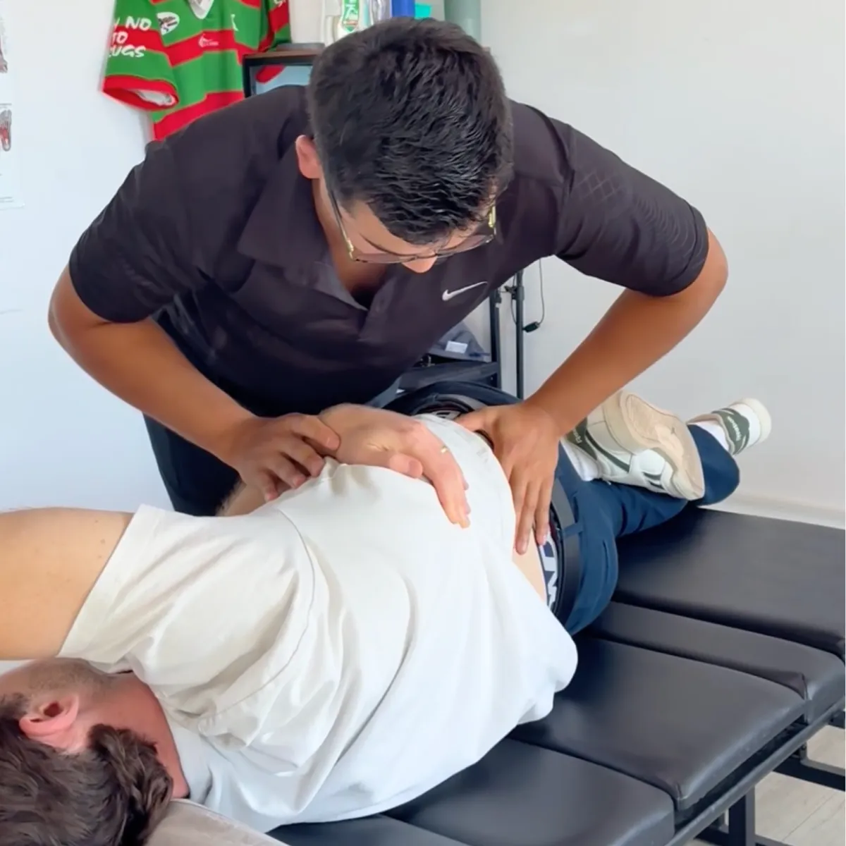 Dr. Brandon - Chiropractor in Campsie adjusting patient
