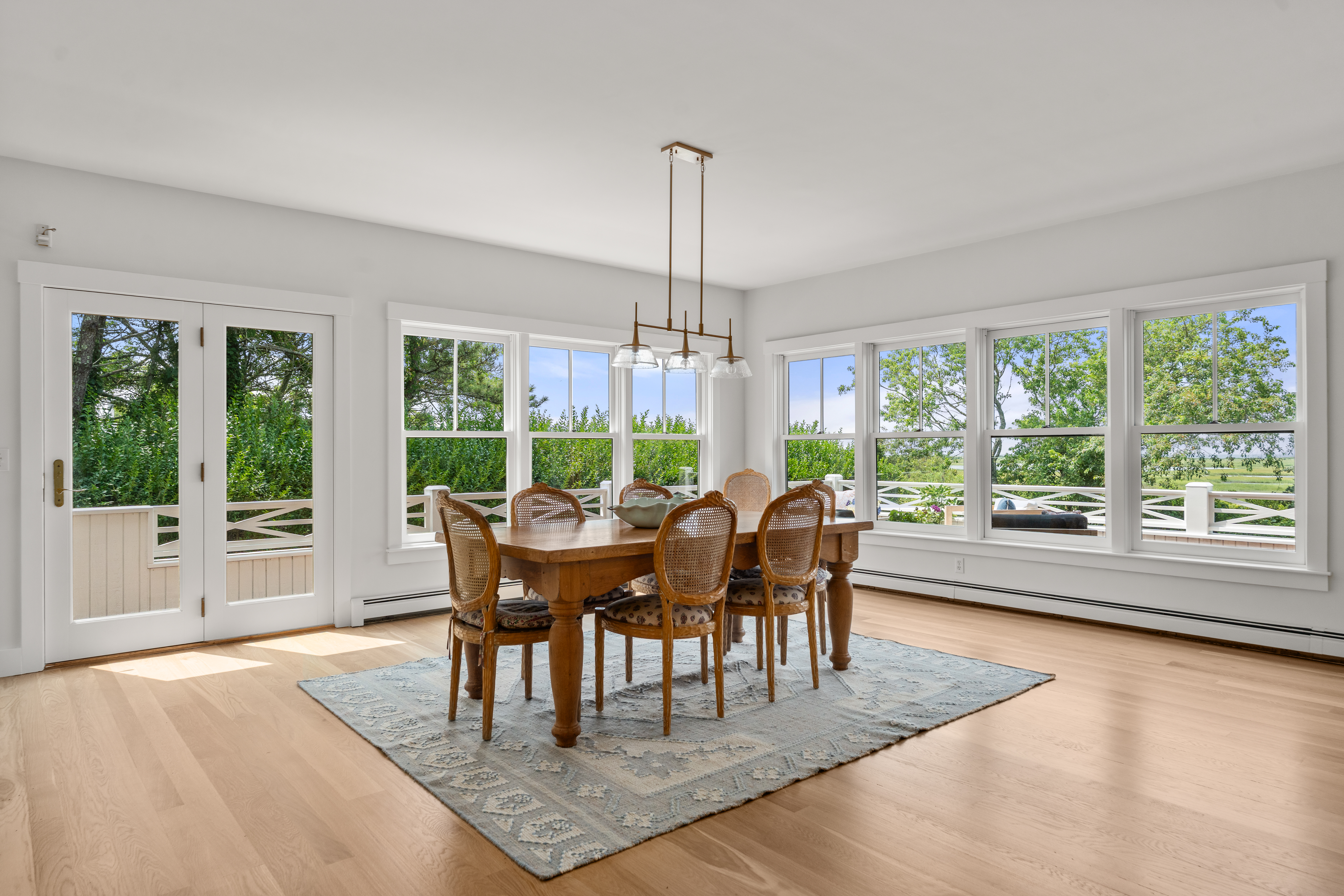 a woman sitting on a couch looking at a laptop