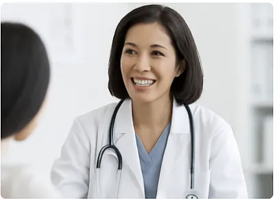 Health professional smiling with stethoscope