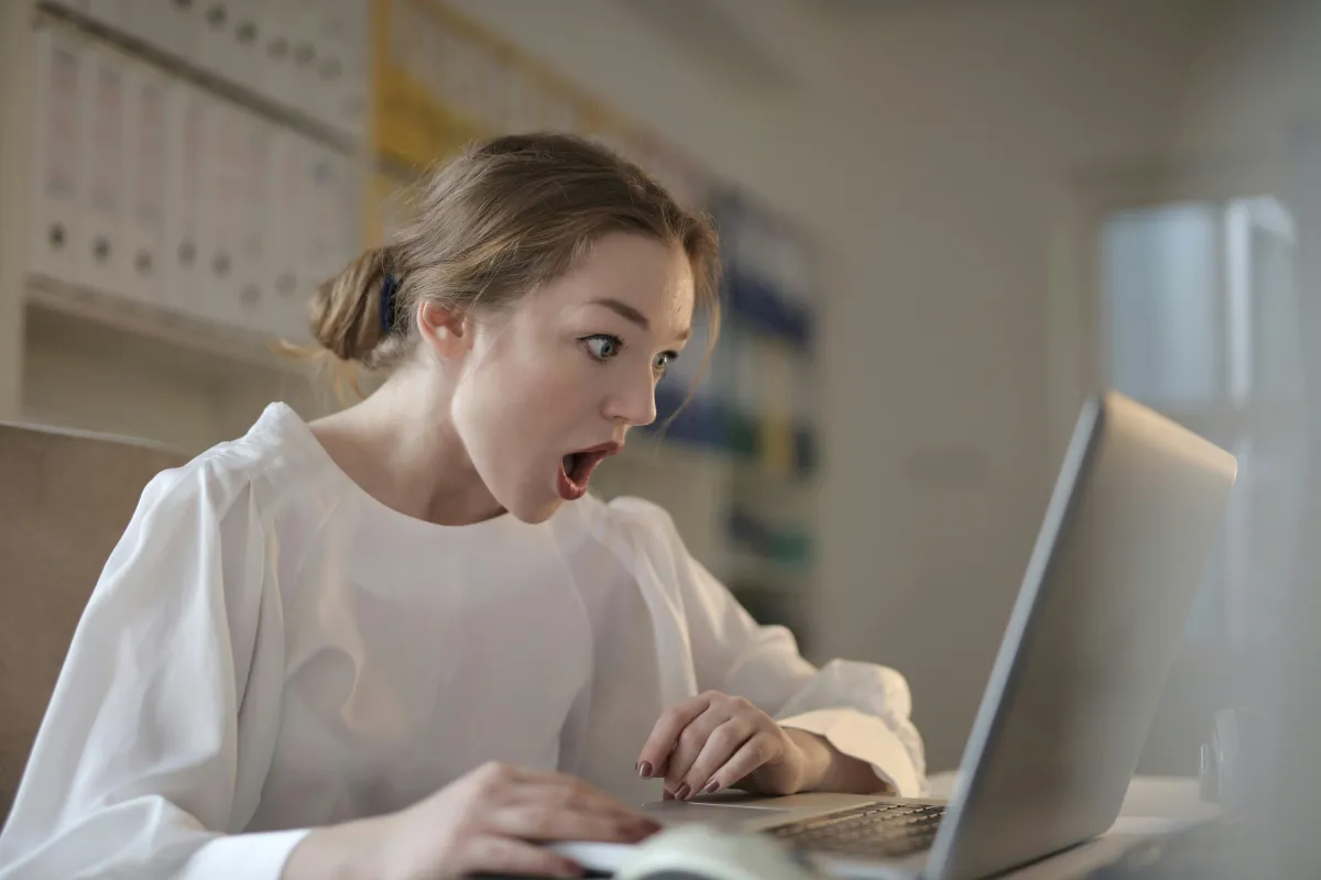 woman sitting infront of MacBook