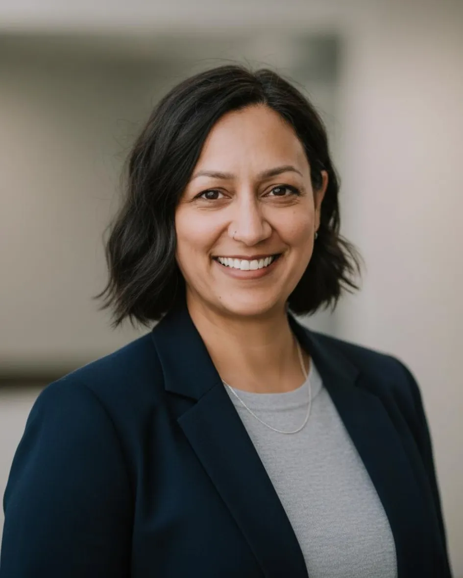 Professional portrait of Dr. Tarah Lynch smiling in a navy blazer