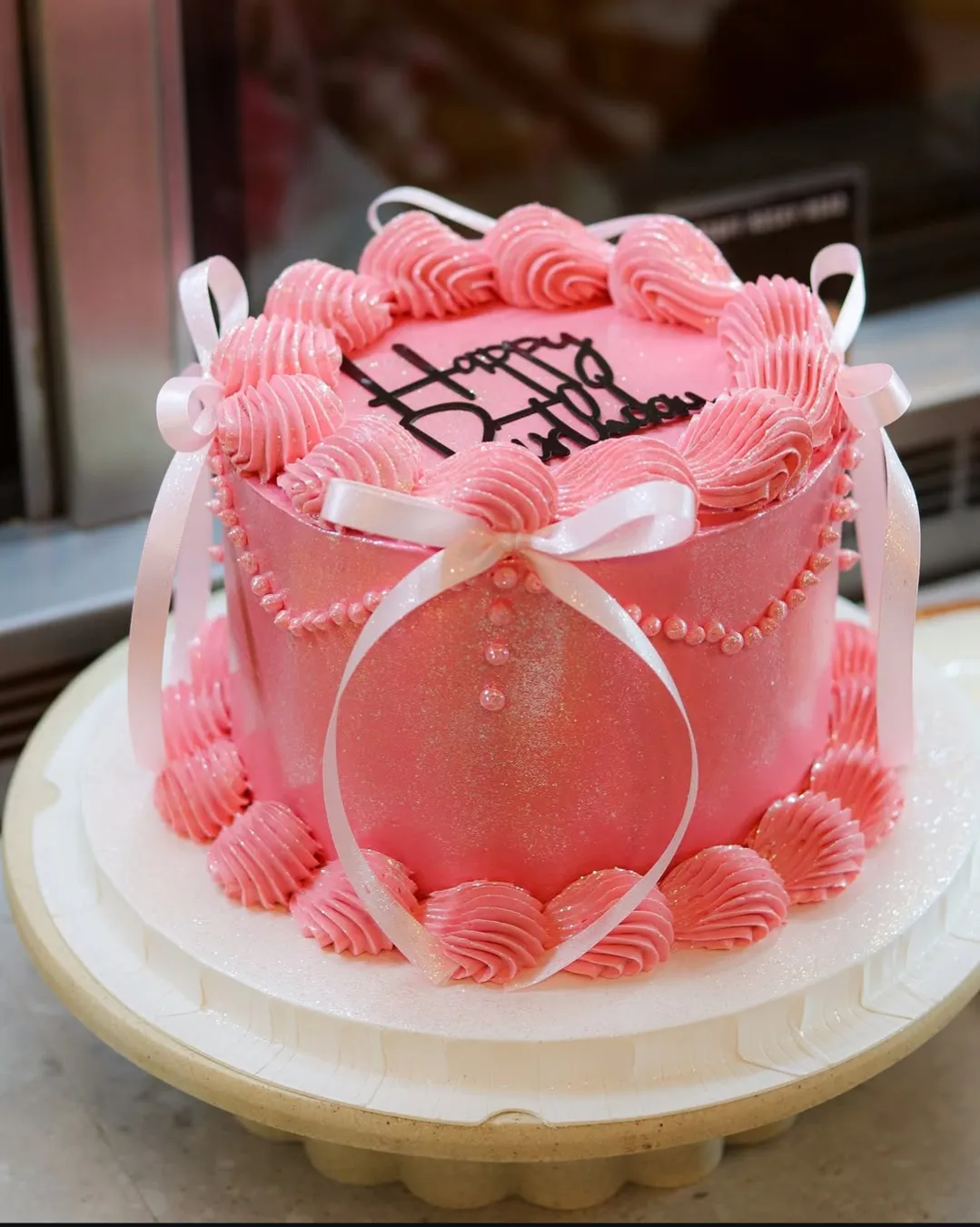 Couple cutting a soft chiffon cake together
