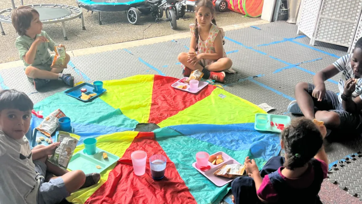 Girl follows directions during arts and crafts time.