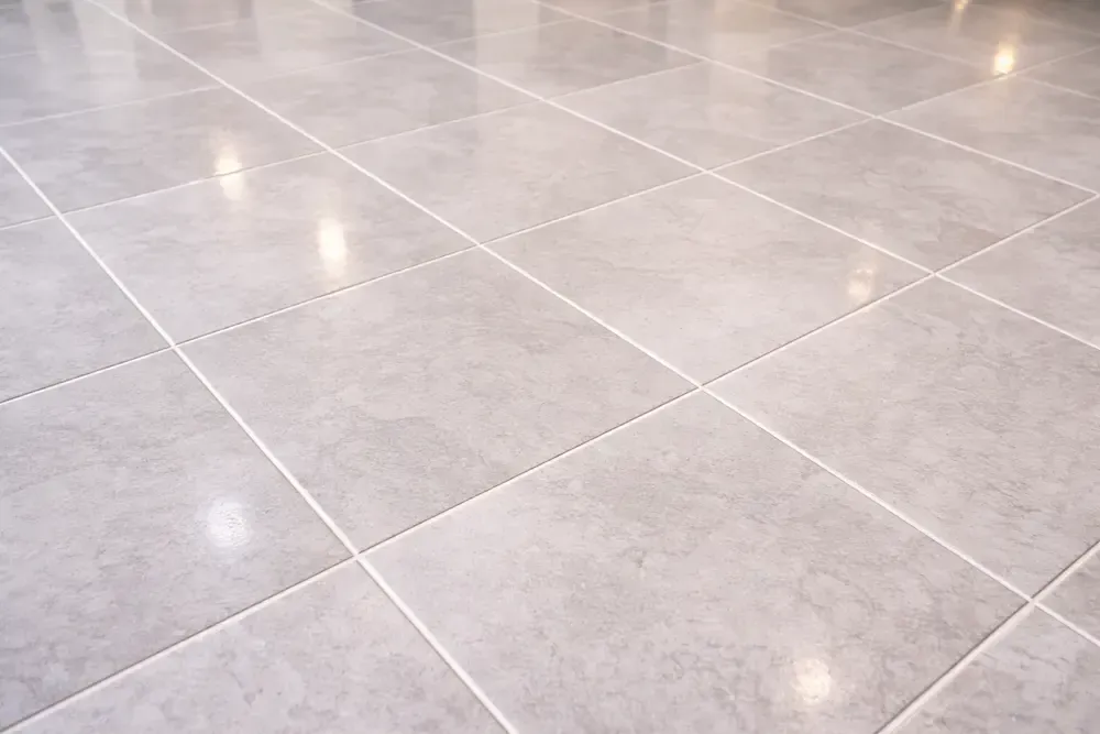 Clean tiles and grout with restored grout lines after professional treatment.
