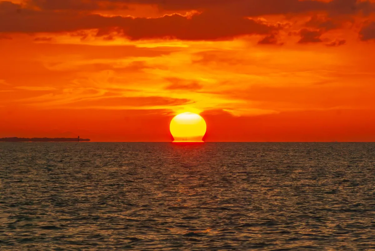 Sun melting into Gulf