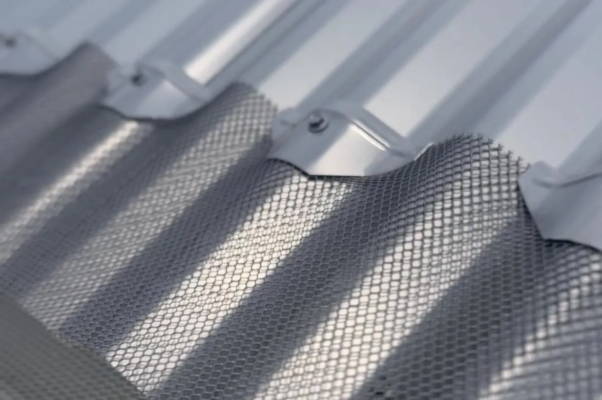 Corrugated gutter guard installation on Colorbond roof for durable leaf protection