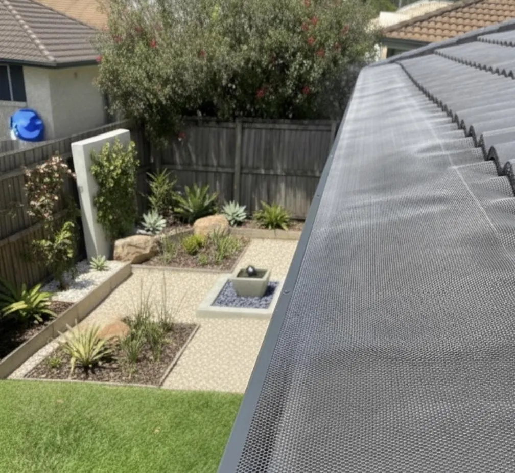 Woodland grey gutter guard installed on tile roof