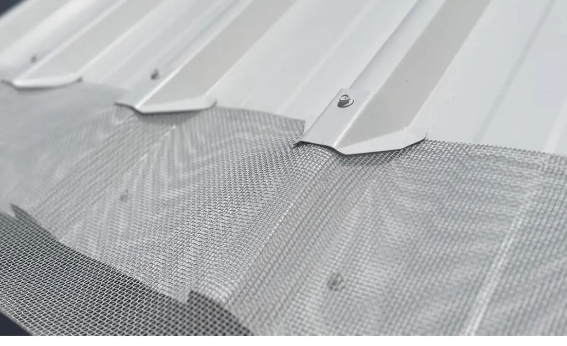 Gutter guard fitted on a Trimdek roof profile, showing Colorbond-matched mesh across the gutter