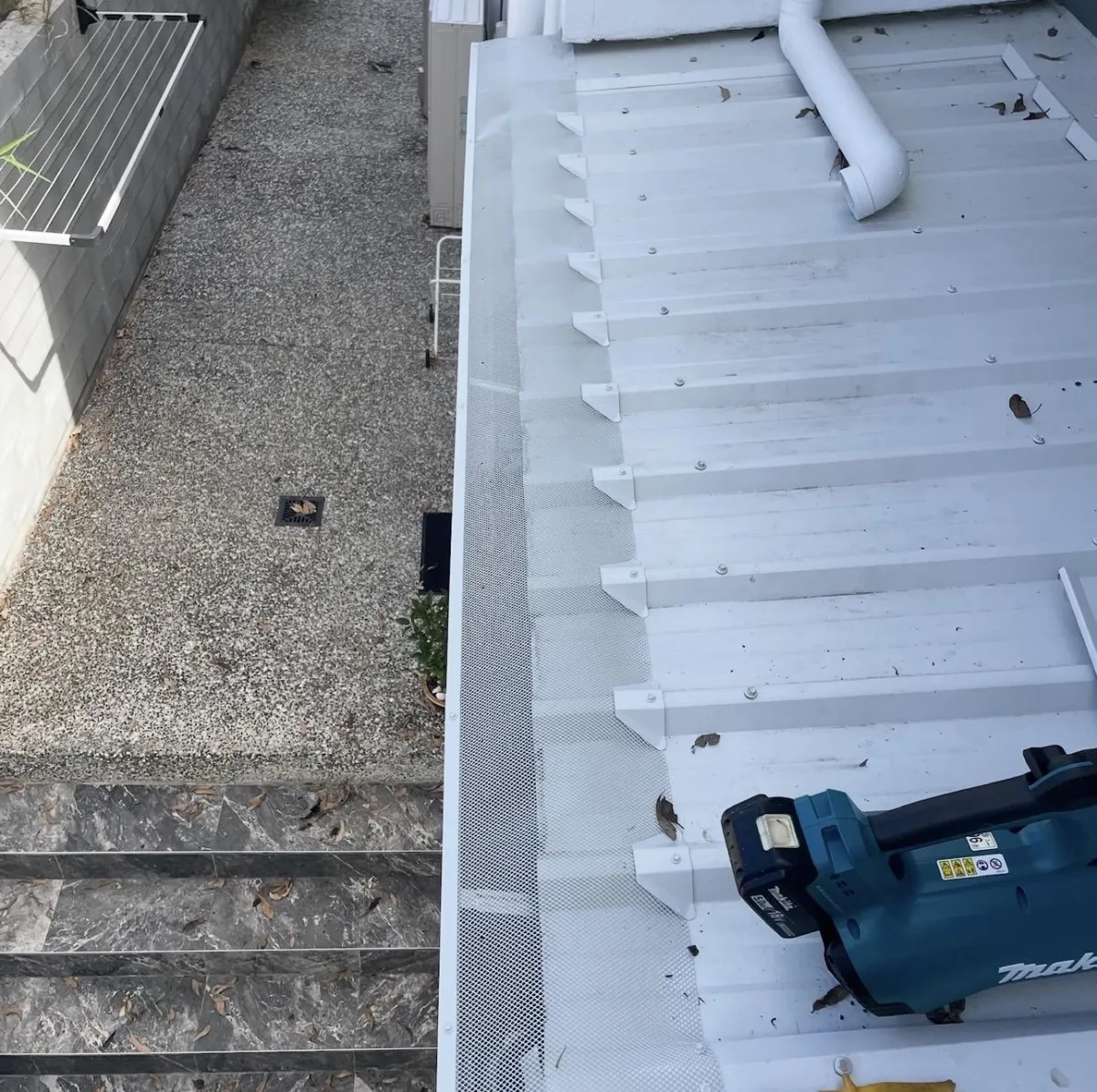 Gutter with trimdek gutter guards installed on it