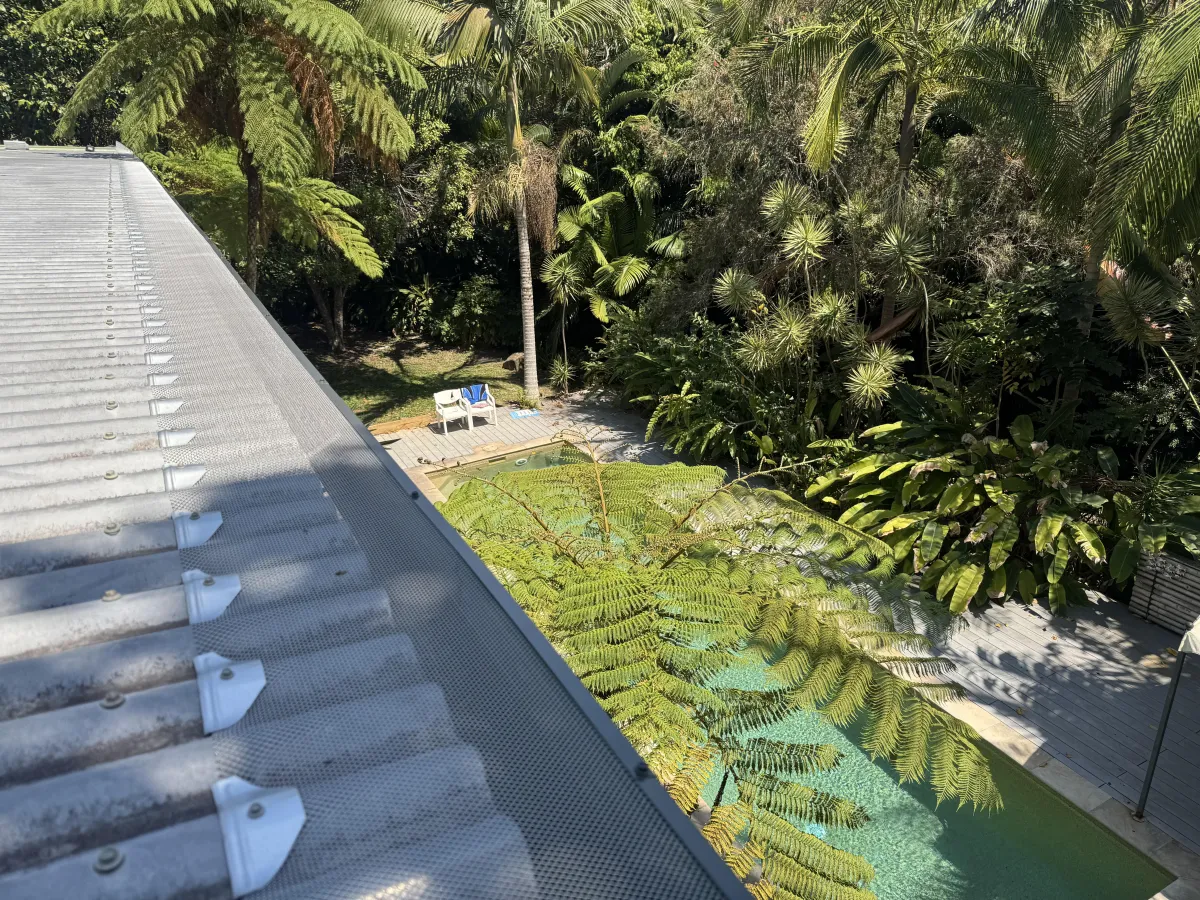 Corrugated roof with aluminium gutter guard installation in Australia