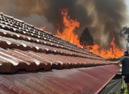 Bushfire-compliant gutter guard installed on tile roof