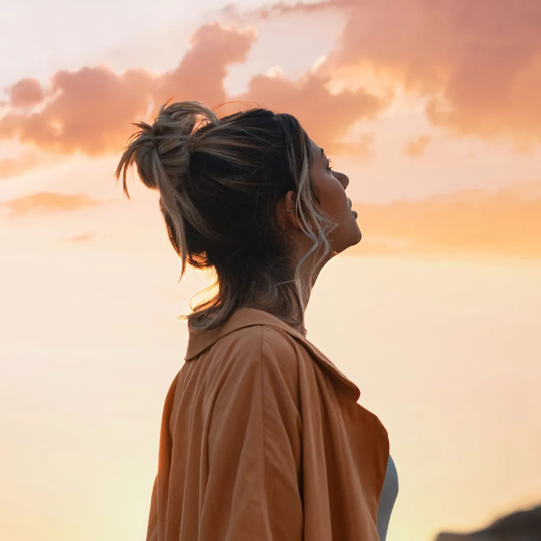 Younger woman looking off into the distance