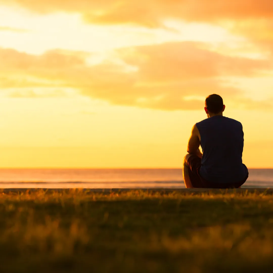 Younger man, looking off into the sunset