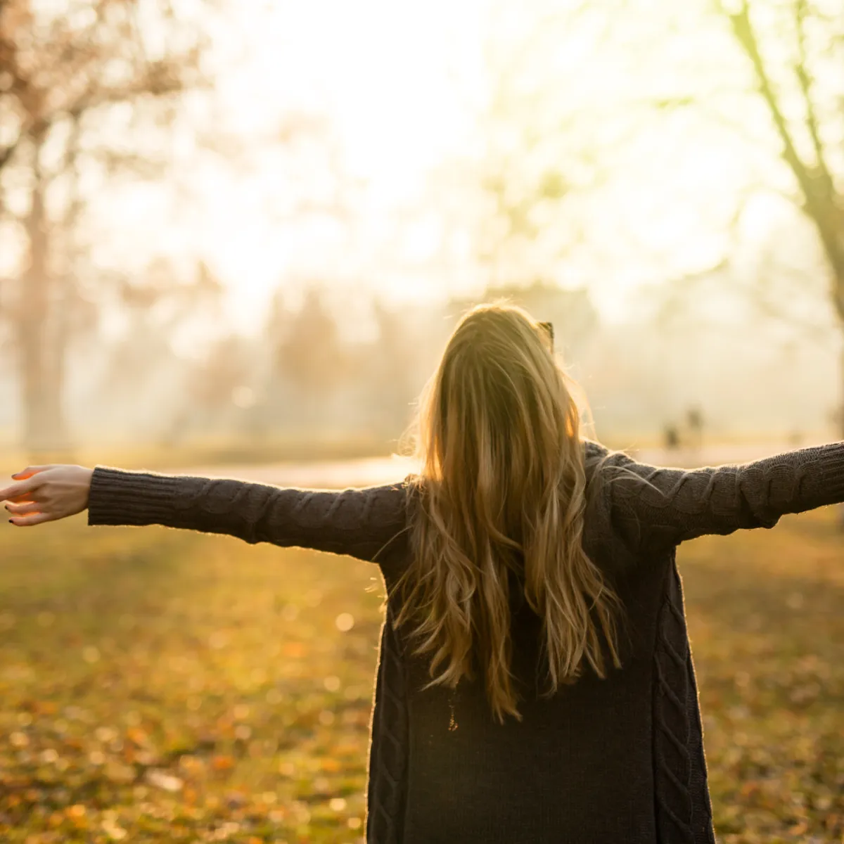 women looking towards the sky in a fall setting