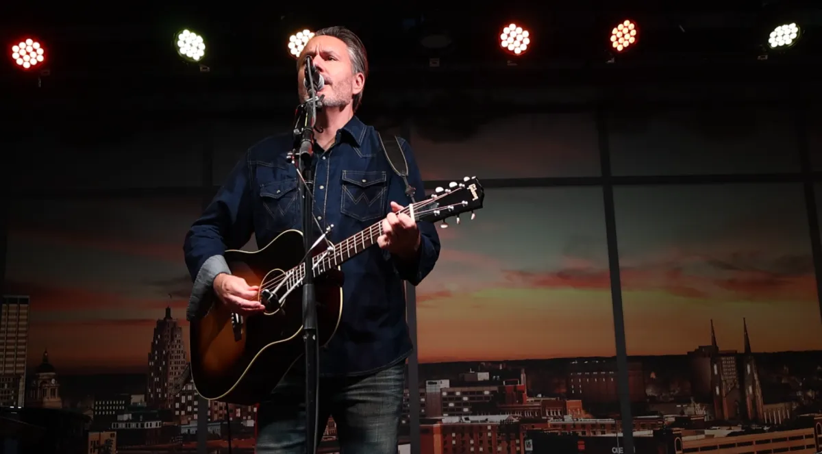 Malachi Jaggers singing and playing guitar