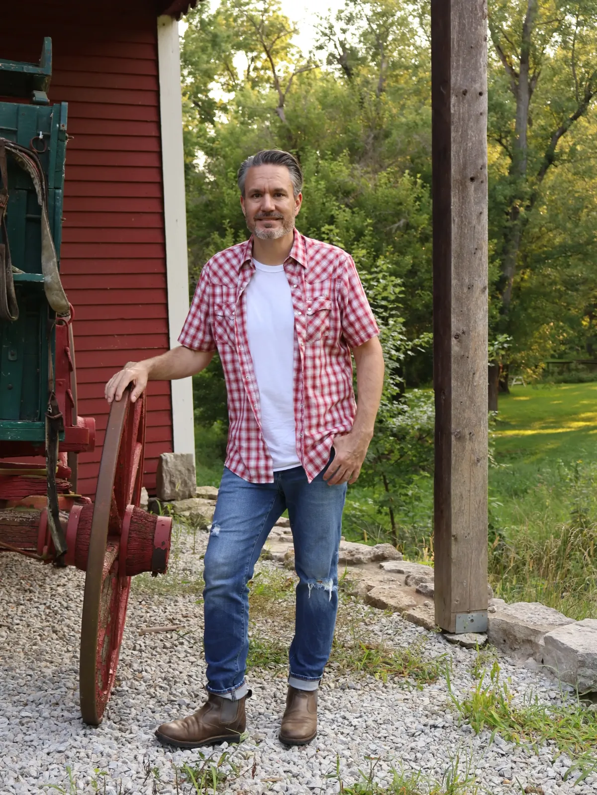 Malachi standing next to a wagon