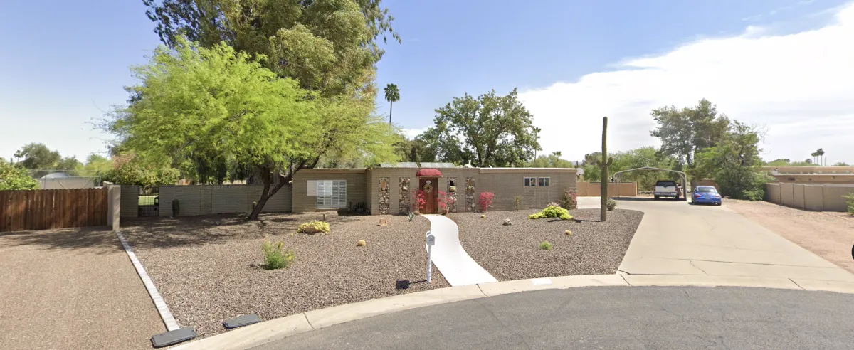 A cool-toned desaturated view of a static real estate property indicating a stalled deal