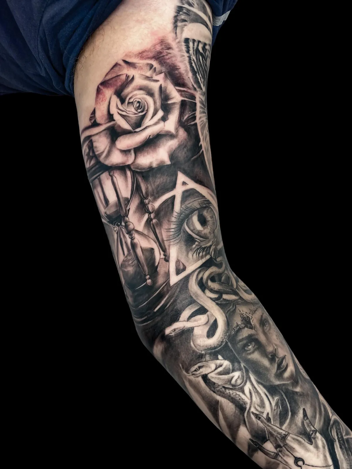 person in blue denim shorts and white nike sneakers standing on gray concrete floor