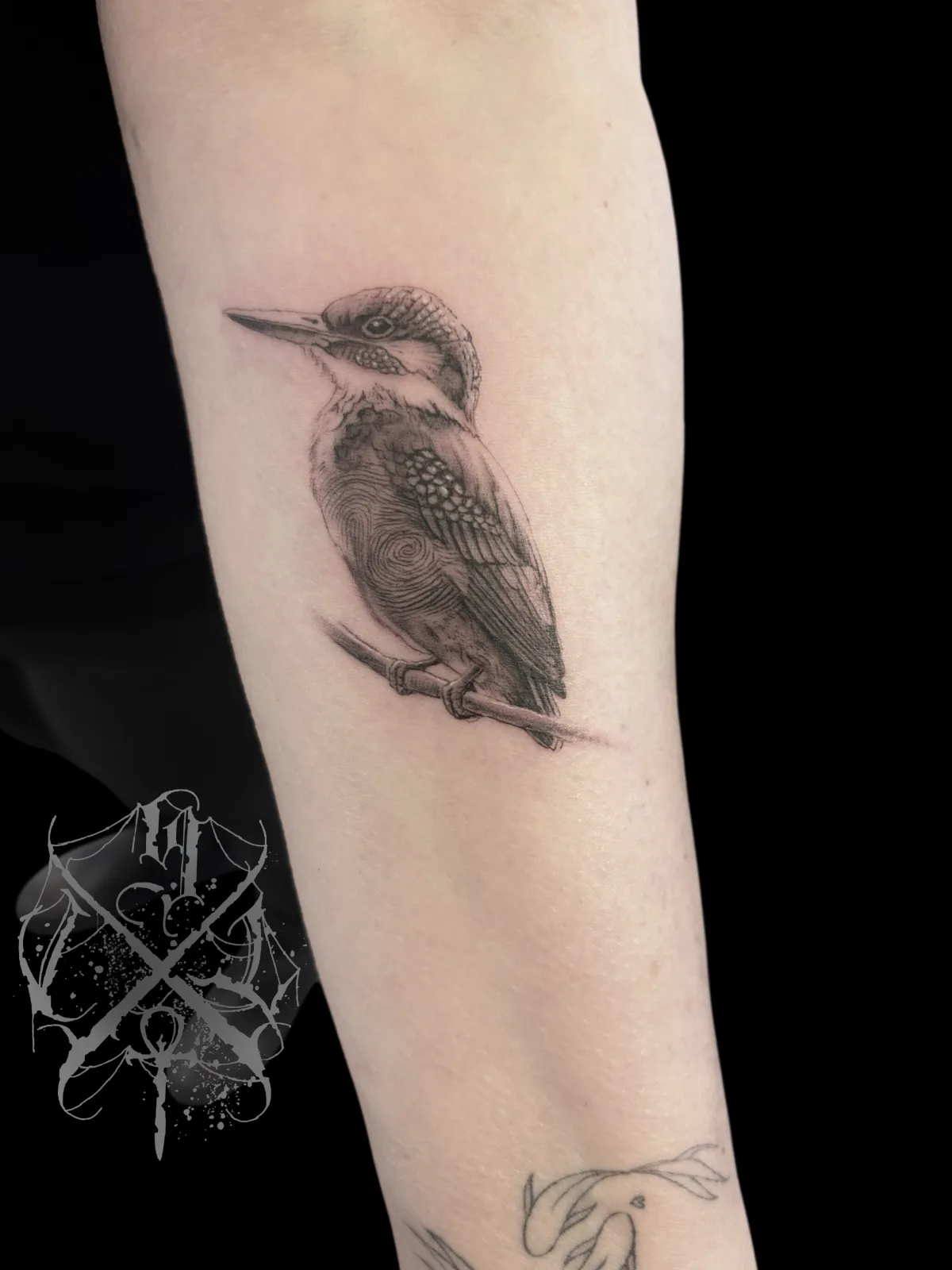 person with tattoo on right arm