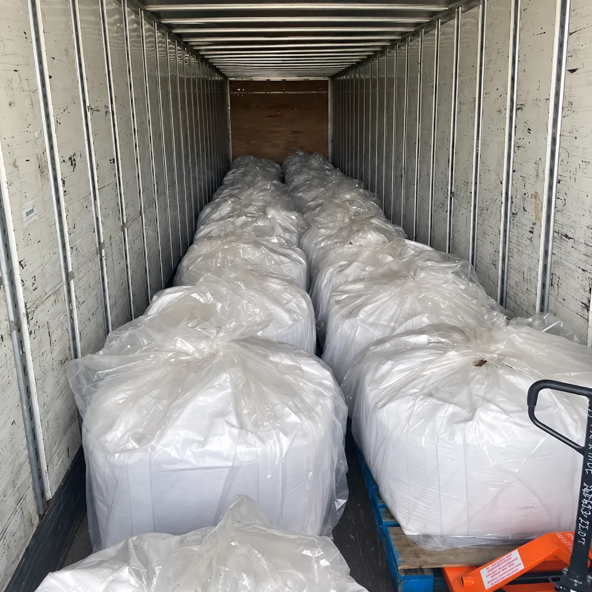 Full truckload of bulk ice melt super sacks prepared for commercial delivery.