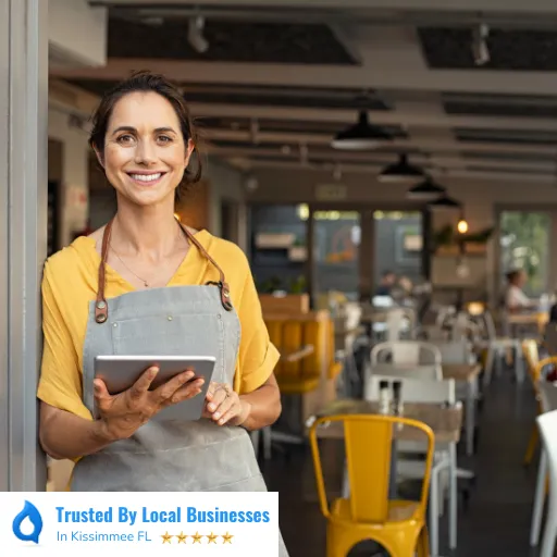 Happy Kissimmee business owner standing confidently in front of their thriving local business after partnering with Living Logos Media for digital marketing services