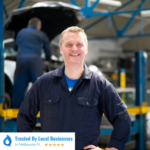 Happy Melbourne business owner standing confidently in front of their thriving local business after partnering with Living Logos Media for digital marketing services