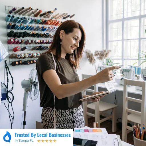 Happy Tampa business owner standing confidently in front of their thriving local business after partnering with Living Logos Media for digital marketing services