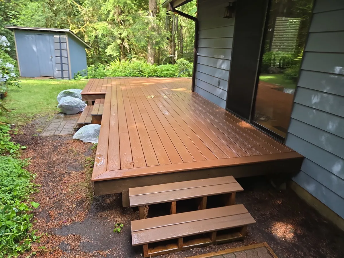 Deck surface being power-washed