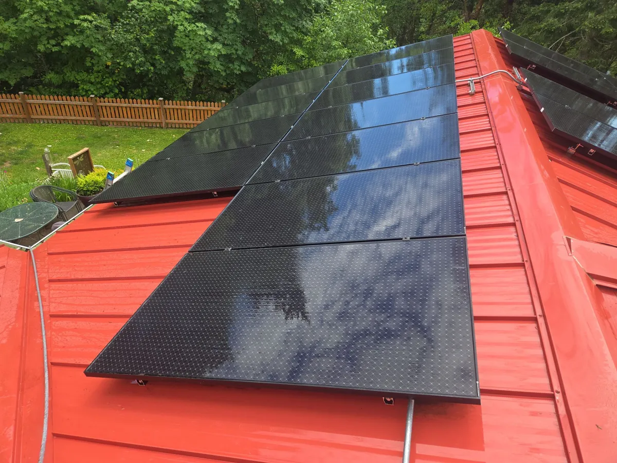 Technician cleaning solar panels