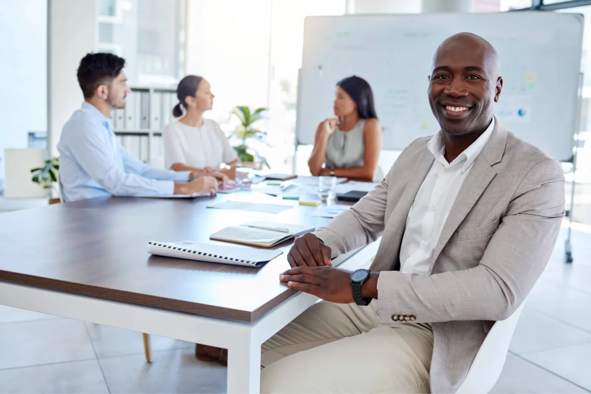three person pointing the silver laptop computer