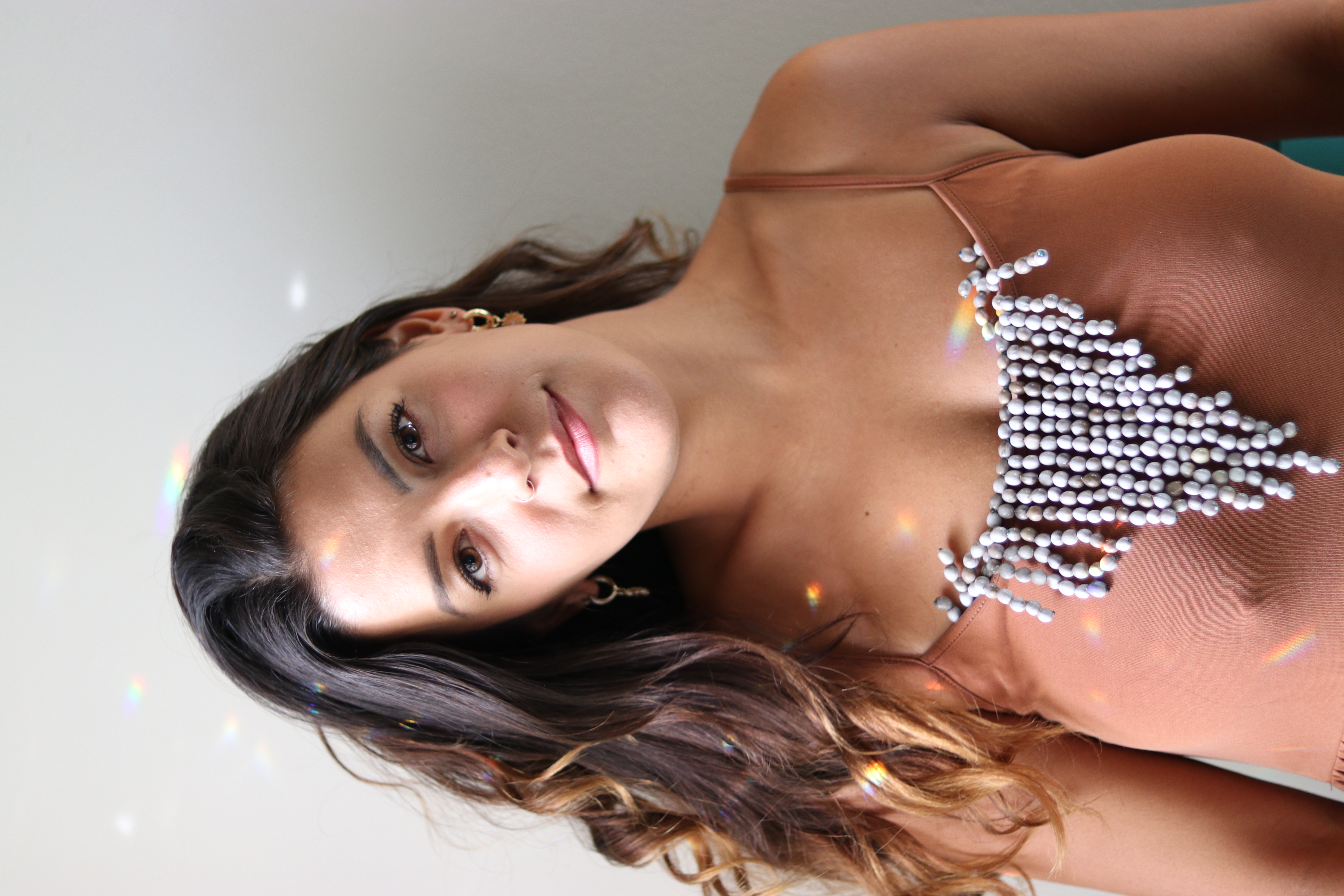 Portrait of Madi smiling in soft window light