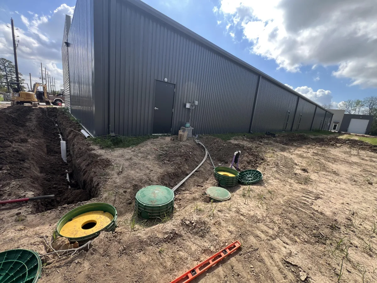 person washing hands in open faucet