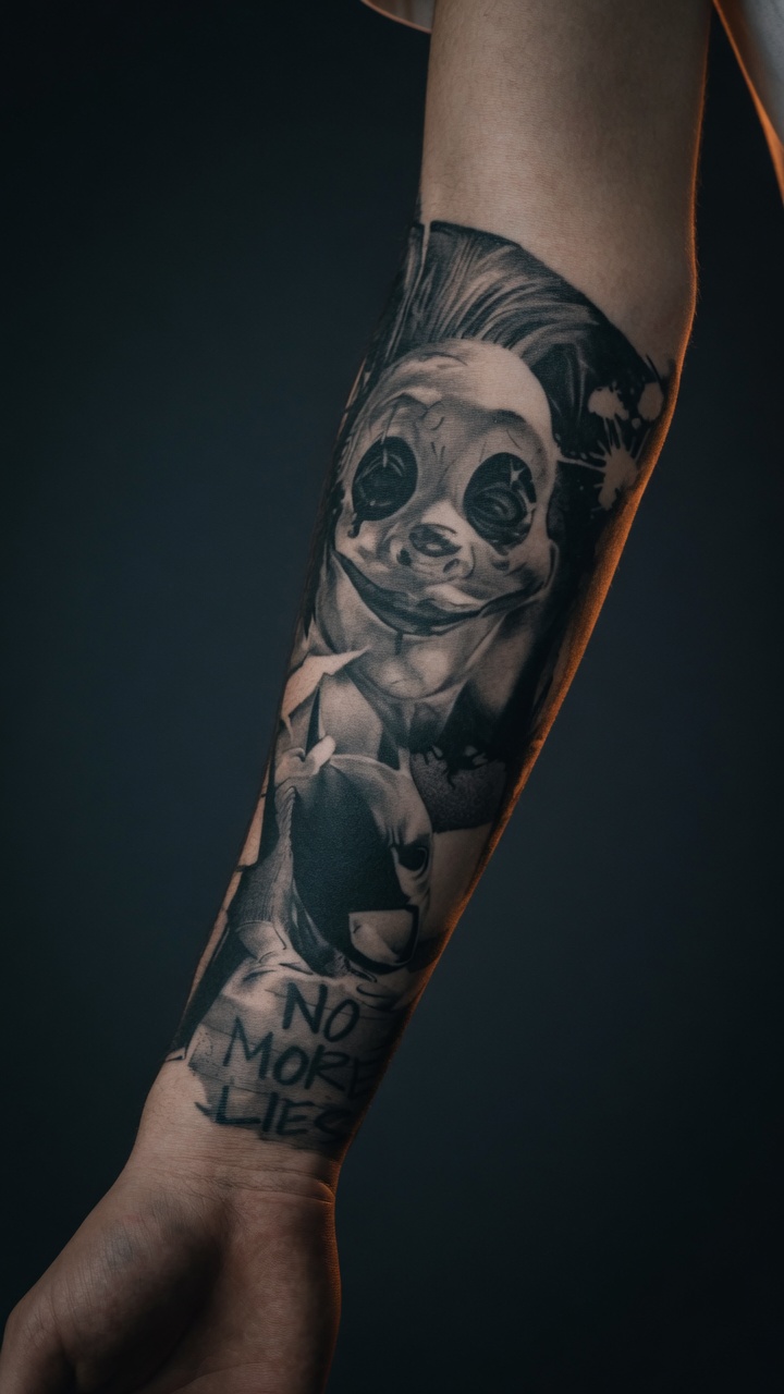 person with tattoo on right arm