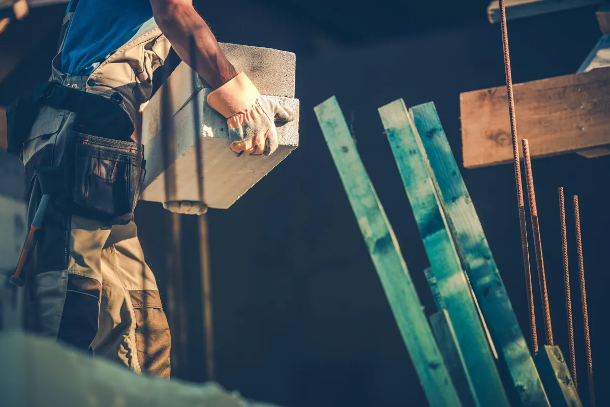 an expert roofer lifting a heavy object