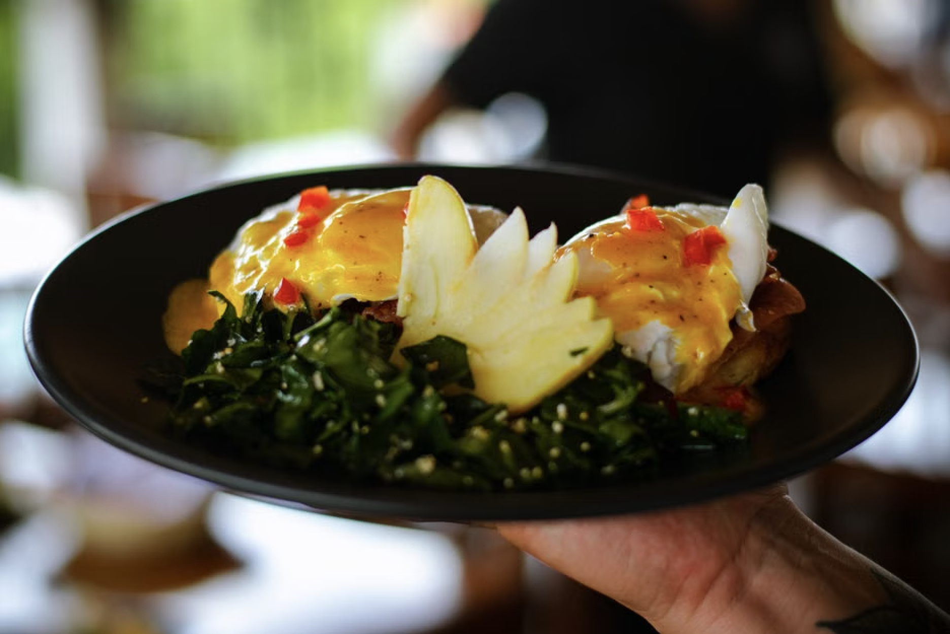 Brown butter benedict served with crispy golden hashbrowns