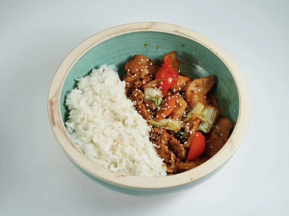 colorful lunch bowl with chicken, rice, and vegetables
