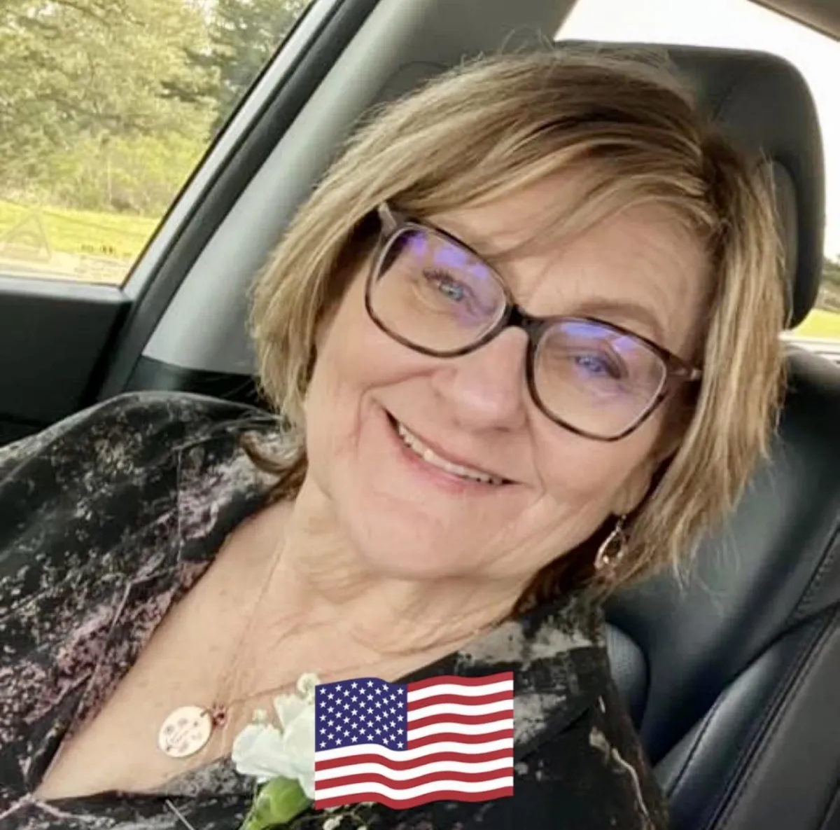 short-haired black cat besides brown wooden table