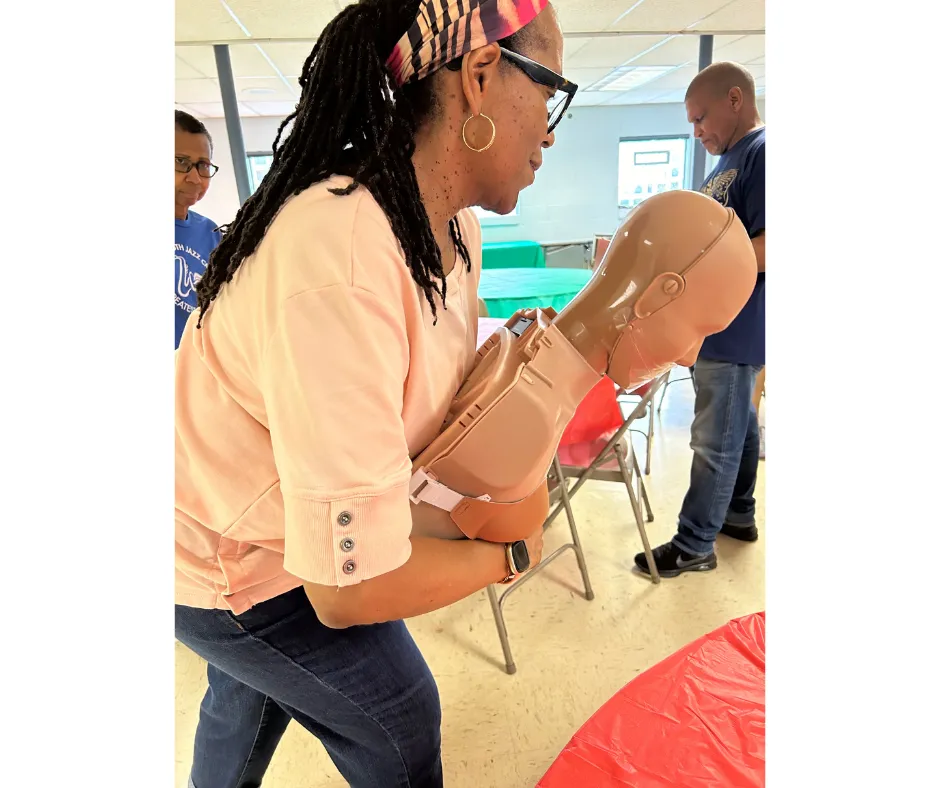 CPR student ding choking relief tehnique