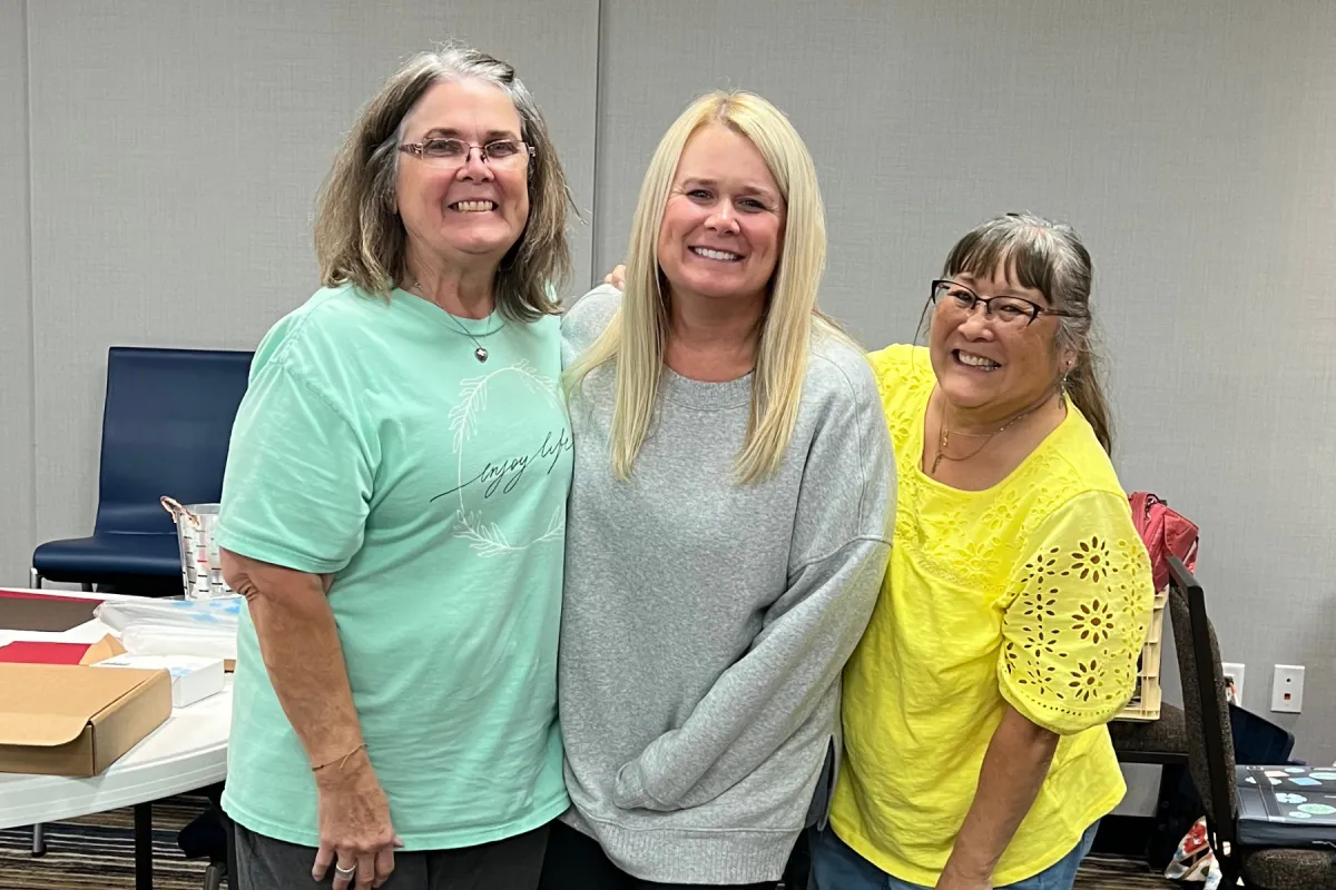 women having fun at a scrapbooking event