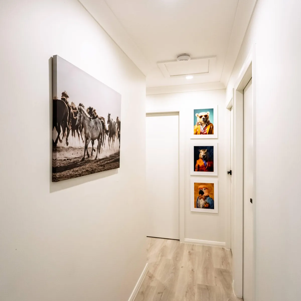 Modern bathroom vanity with marble tiles and round mirror
