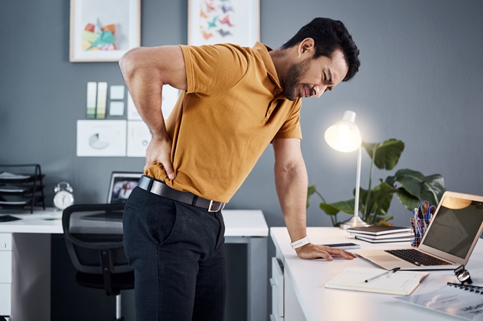 Man with Back Pain at work